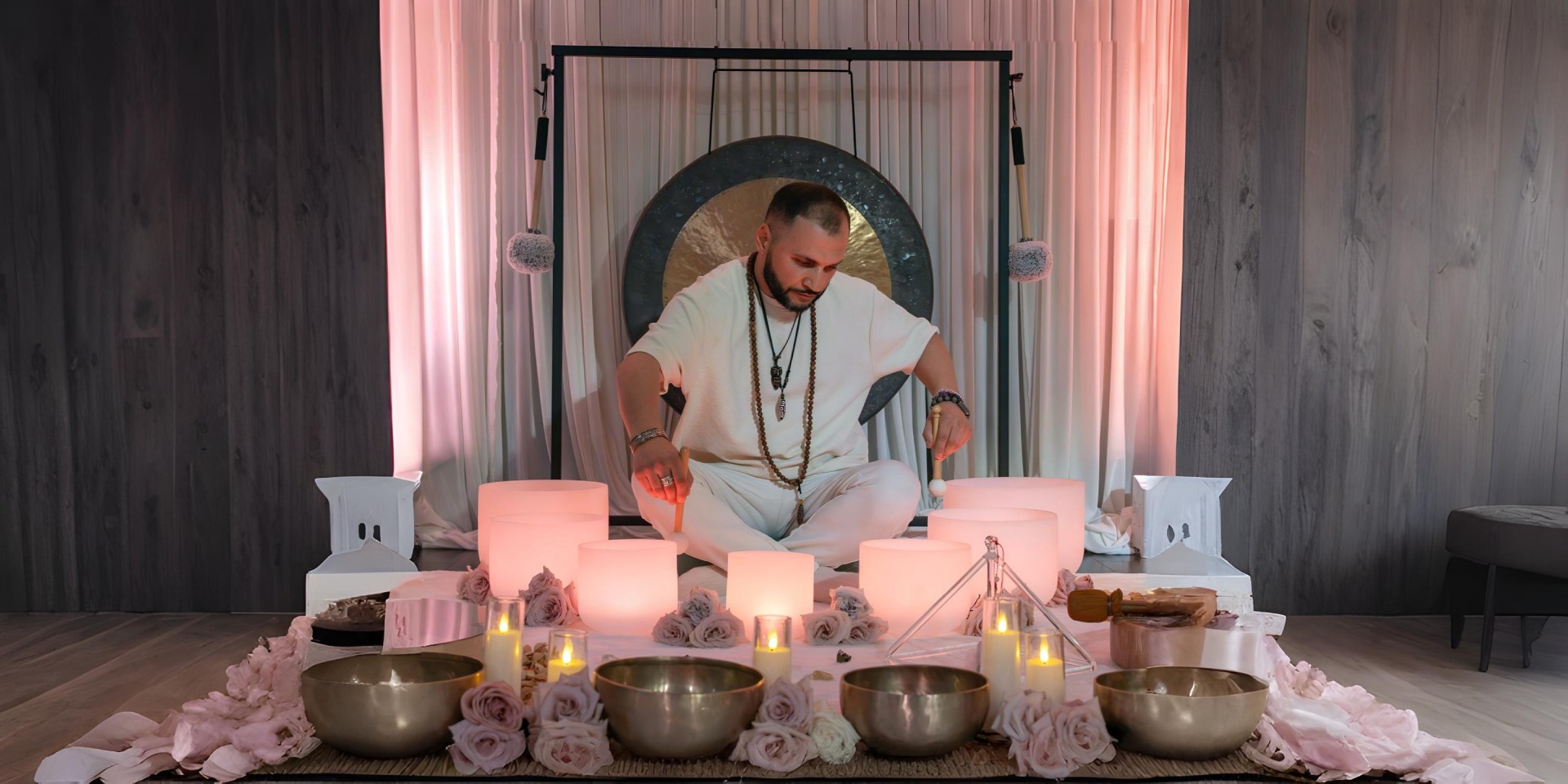 Levon Gasparyan leading a sound healing session with singing bowls and a gong